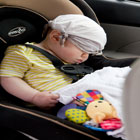 Keep vehicle cool with child inside the car with handkerchief on top of his head
